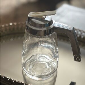 Vintage Federal Housewares glass syrup dispenser with a plastic lid and handle